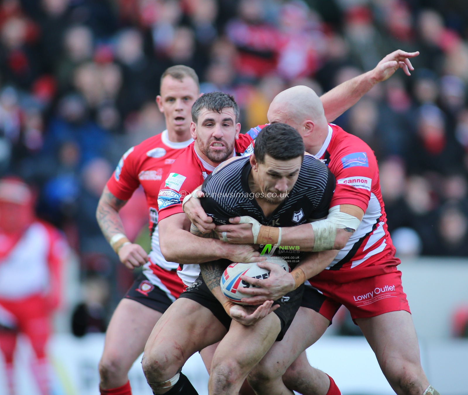 8th February 2020, AJ Bell Stadium, Eccles, England; Betfred Super League, Salford Red Devils v Toronto Wolfpack : Sonny Bill Williams of Toronto Wolfpack wrapped up by the Salford Red Devils defence.