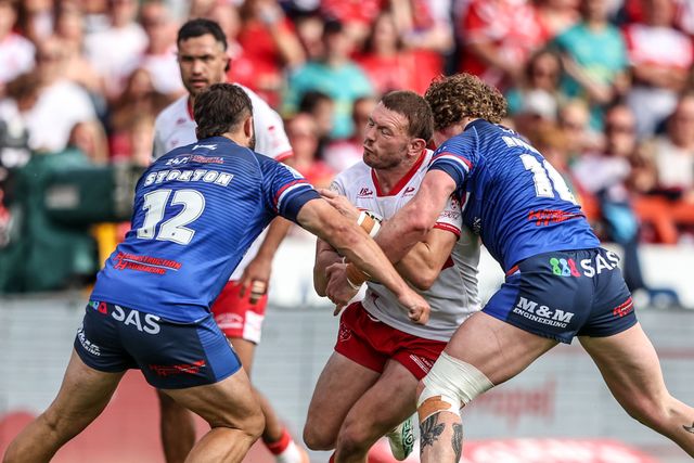 James Batchelor of Hull KR is tackled by Matty Storton of Wakefield Trinity and Ky Rodwell of Wakefield Trinity during the Betfred Super League round 18 match Hull KR vs Wakefield Trinity at Sewell Group Craven Park, Hull, United Kingdom on 11 July 2026

(Photo by Alfie Cosgrove/News Images)