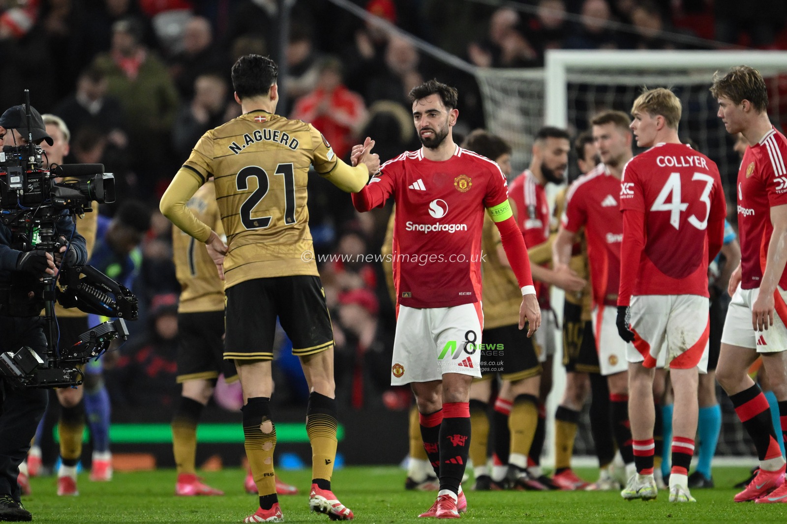 Nayef Aguerd of Real Sociedad shakes hands with Bruno Fernandes of Manchester United during the UEFA Europa League Last 16 match Manchester United vs Real Sociedad at Old Trafford, Manchester, United Kingdom, 13th March 2025

(Photo by Craig Thomas/News Images)