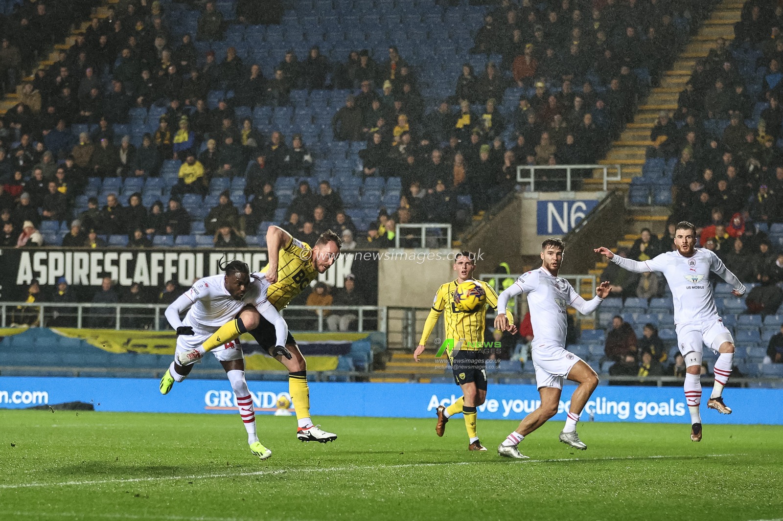 Sam Long of Oxford United scores an own goal to make it 0-1after heâ€™s pressured by Devante Cole of Barnsley  during the Sky Bet League 1 match Oxford United vs Barnsley at Kassam Stadium, Oxford, United Kingdom, 23rd January 2024

(Photo by Mark Cosgrove/News Images)