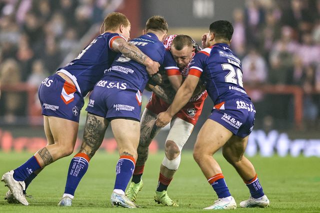 Josh Charley of Leigh Leopards is tackled by Tom Johnstone of Wakefield Trinity and Mason Lino of Wakefield Trinity during the Betfred Super League play-off Eliminator 1 match Leigh Leopards vs Wakefield Trinity at Progress With Unity Stadium, Leigh, United Kingdom, 26th September 2025

(Photo by Alfie Cosgrove/News Images)