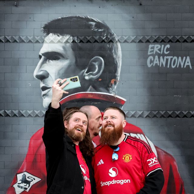 Manchester United fans take a selfie at the Eric Cantona mural during the Premier League match Manchester United vs Brentford at Old Trafford, Manchester, United Kingdom on 27 April 2026

(Photo by Mark Cosgrove/News Images)