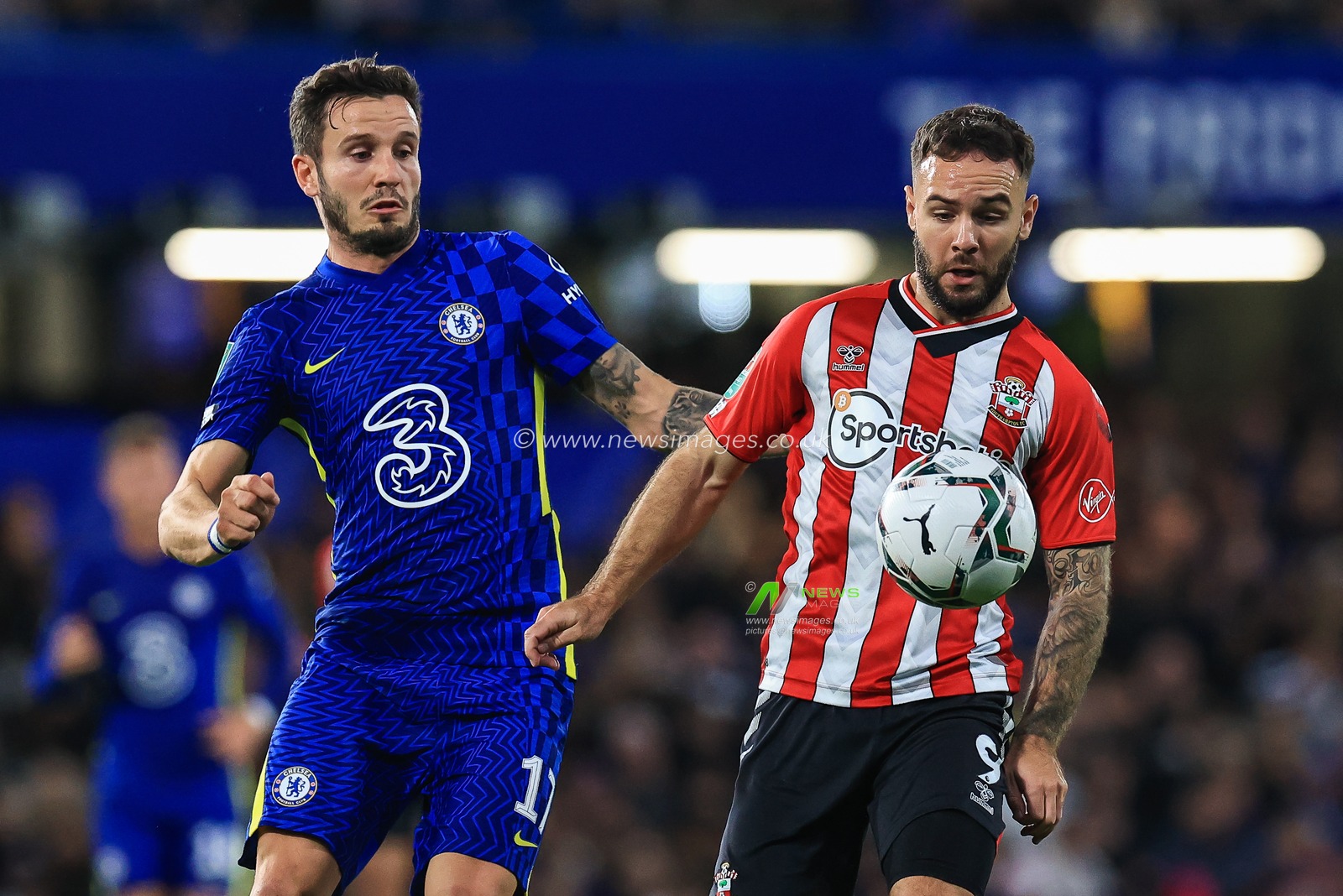 Adam Armstrong #9 of Southampton controls the ball despite the press from Saul Ã‘iguez #17 of Chelsea