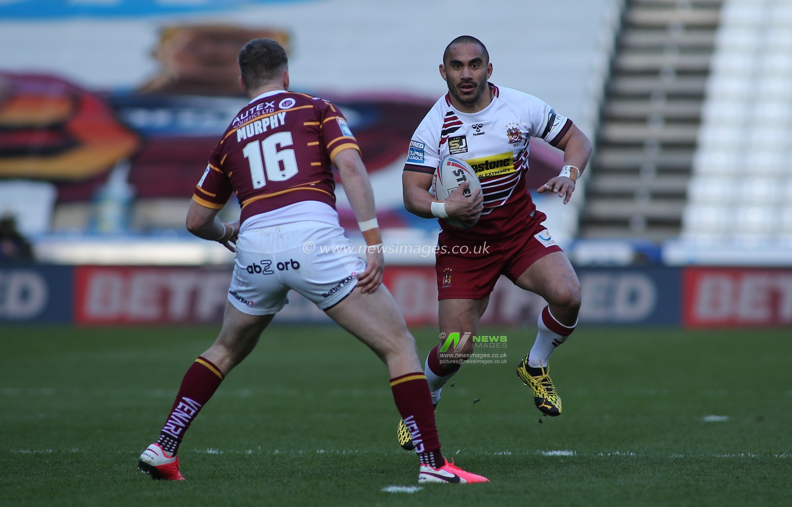 1st March 2020, John Smith's Stadium, Huddersfield, England; Betfred Super League, Huddersfield Giants v Wigan Warriors : Tommy Leuluai of Wigan Warriors on the attack against Aaron Murphy of Huddersfield Giants
