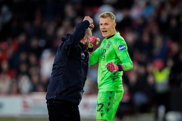 Blackburn Rovers goalkeeper Balazs Toth reacts after a fan invades the pitch to celebrate Yuki Ohashi of Blackburn Rovers scoring a goal to make it 0-2  during the Sky Bet Championship match Sheffield United vs Blackburn Rovers at Bramall Lane, Sheffield, United Kingdom on 22 April 2026

(Photo by Maynard Manyowa/News Images)