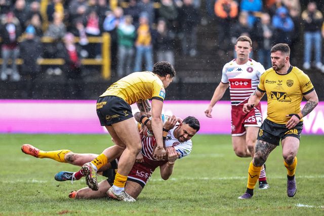 Bevan French of Wigan Warriors is tackled during the Betfred Super League round 1 match Castleford Tigers vs Wigan Warriors at OneBore Stadium, Castleford, Untied Kingdom on 15 February 2026

(Photo by Alfie Cosgrove/News Images)