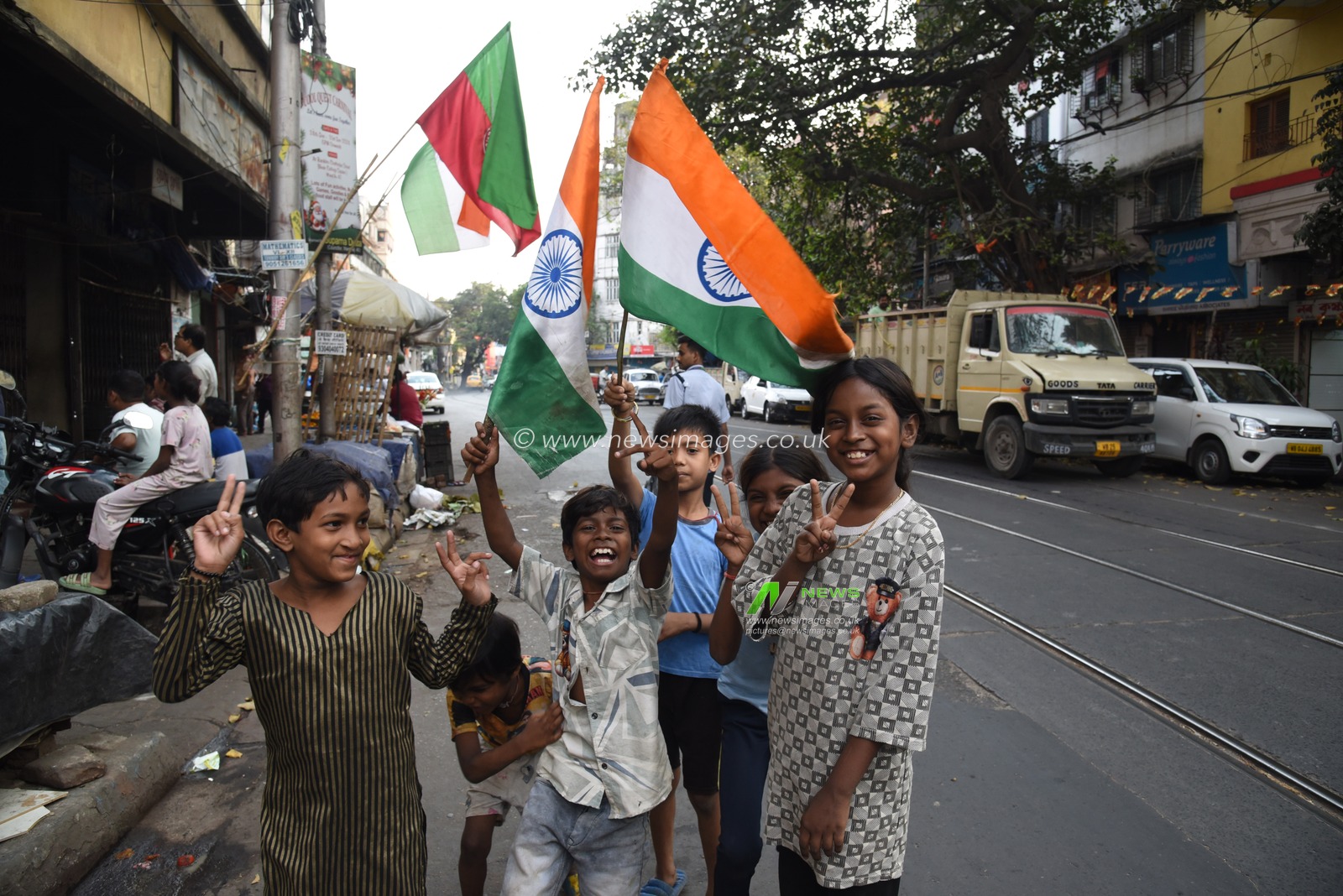 Indian fans celebrates with National Flgs of Champions Trophy 
Final match between India and New Zealand on LED TV, on March 9,2025 in Kolkata, India. Pictures by Debajyoti Chakraborty.(Photo: Debajyoti Chakraborty/News Images)