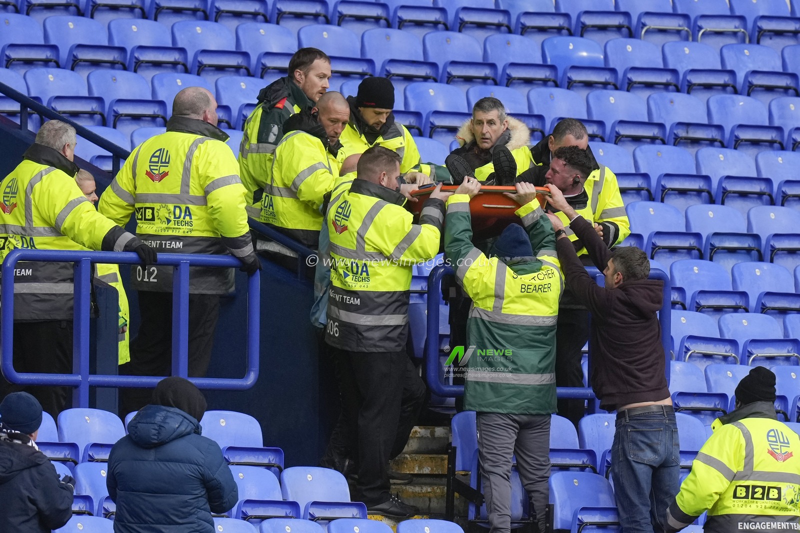 Stewards and Paramedics lift a stretcher down from the stand during a medical emergency during the Sky Bet League 1 match Bolton Wanderers vs Cheltenham Town at Toughsheet Community Stadium, Bolton, United Kingdom, 13th January 2024

(Photo by Steve Flynn/News Images)