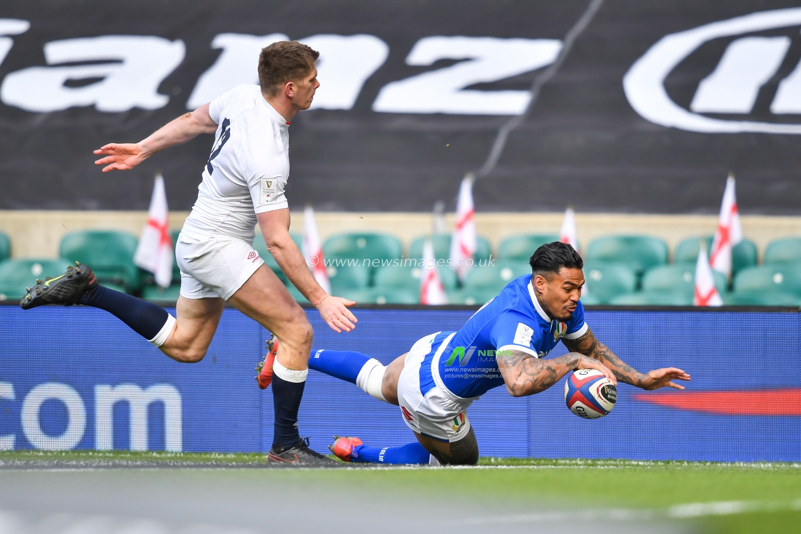 Monty Ioane of Italy goes over for a try
