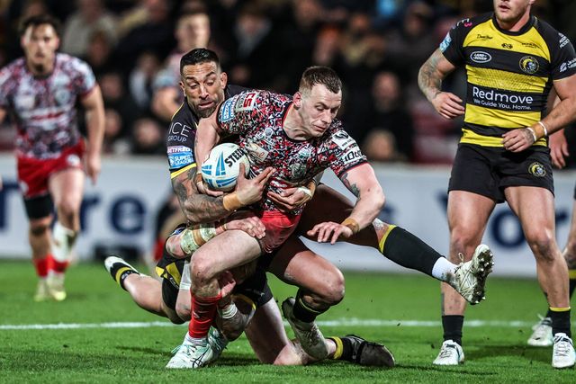 Frankie Halton of Leigh Leopards is tackled by Paul Vaughan of York Knights and Jack Martin of York Knights during the Betfred Super League round 8 match York Knights vs Leigh Leopards at LNER Community Stadium, York, United Kingdom on 17 April 2026

(Photo by Alfie Cosgrove/News Images)