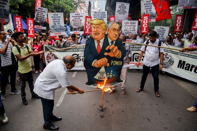 Activists from the Socialist Unity Centre of India (SUCI) burned an effigy of U.S. President Donald Trump and Israeli Prime Minister Benjamin Netanyahu during an anti-Israel protest to express solidarity with Palestinians, in Kolkata on October 7, 2025.Photo by Debajyoti Chakraborty.(Photo: Debajyoti Chakraborty/News Images)