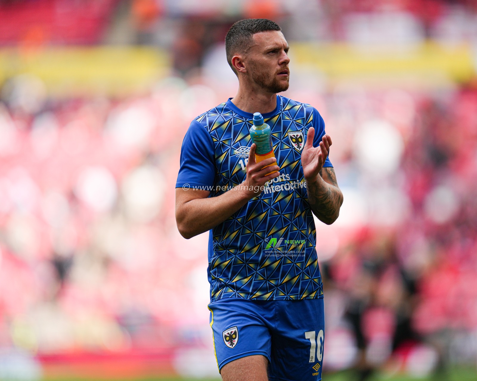 Josh Kelly of AFC Wimbledon clapping supporters ahead of the Sky Bet League 2 Playoff Final match AFC Wimbledon vs Walsall at Wembley Stadium, London, United Kingdom, 26th May 2025

(Photo by Harvey Murphy/News Images)