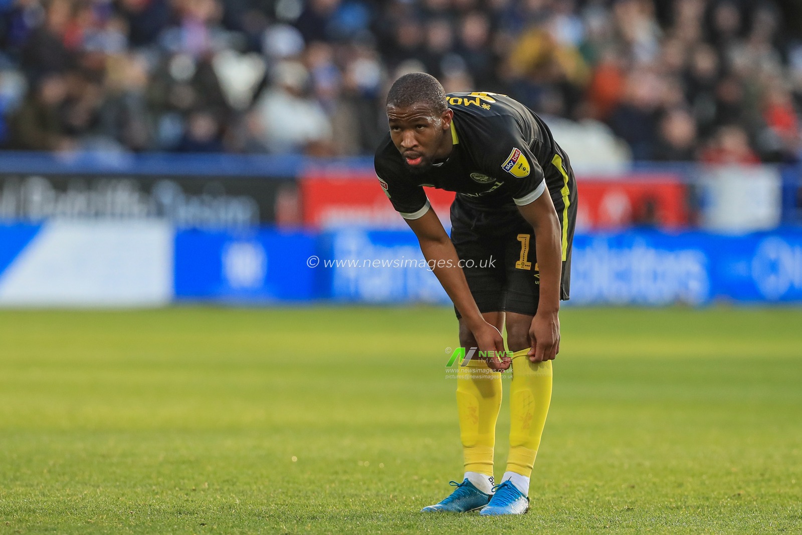 18th January 2020, John Smith's Stadium, Huddersfield, England; Sky Bet Championship, Huddersfield Town v Brentford : Ollie Watkins (11) of Brentford pulls up his socks 

Credit: Mark Cosgrove/News Images