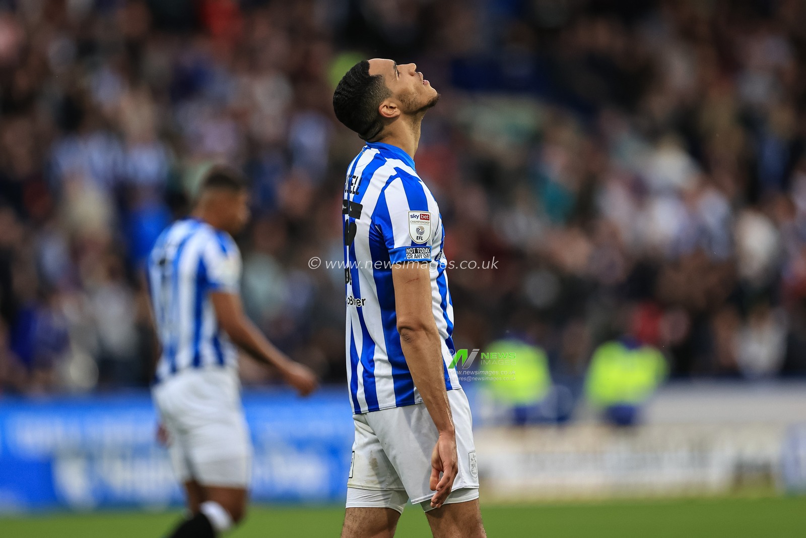Jon Russell #37 of Huddersfield Town reacts after the final whistle