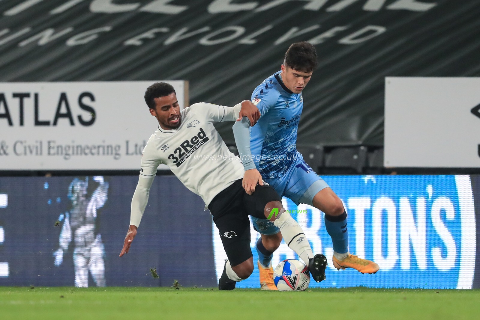 Ryan Giles #18 of Coventry City is tackled by Nathan Byrne #12 of Derby County