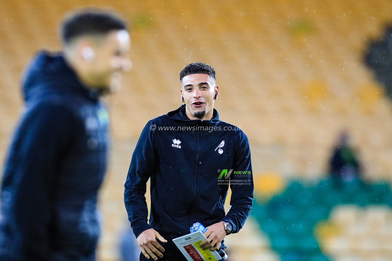 15th February 2020, Carrow Road, Norwich, England; Premier League, Norwich City v Liverpool :  Ben Godfrey (04) of Norwich City shares a joke with Max Aarons ahead of kick-off