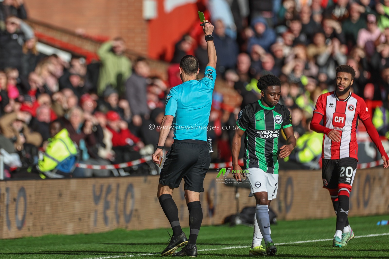Referee Stuart Attwell gives a yellow card to Tariq Lamptey of Brighton & Hove Albion during the Premier League match Sheffield United vs Brighton and Hove Albion at Bramall Lane, Sheffield, United Kingdom, 18th February 2024

(Photo by Mark Cosgrove/News Images)