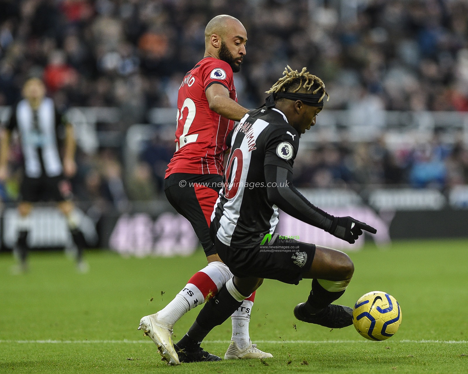 8th December 2019, St. James's Park, Newcastle, England; Premier League, Newcastle United v Southampton : Allan Saint-Maximin (10) of Newcastle United under pressure from Nathan Redmond (22) of Southampton

Credit: Iam Burn/News Images