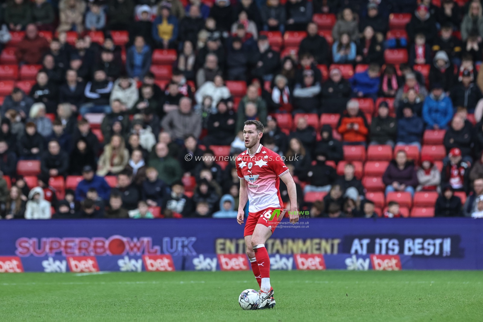 Jamie McCart of Barnsley breaks with the ball during the Sky Bet League 1 match Barnsley vs Cheltenham Town at Oakwell, Barnsley, United Kingdom, 16th March 2024

(Photo by Mark Cosgrove/News Images)