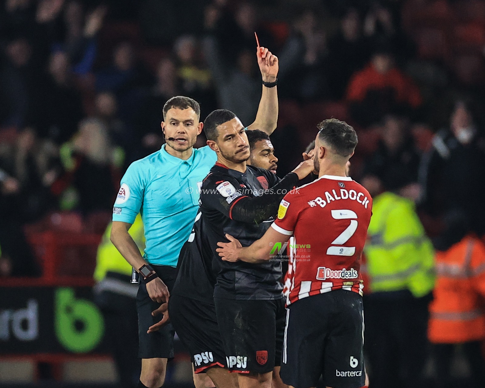 Referee Leigh Doughty gives Jake Livermore #8 of West Bromwich Albion a straight red card