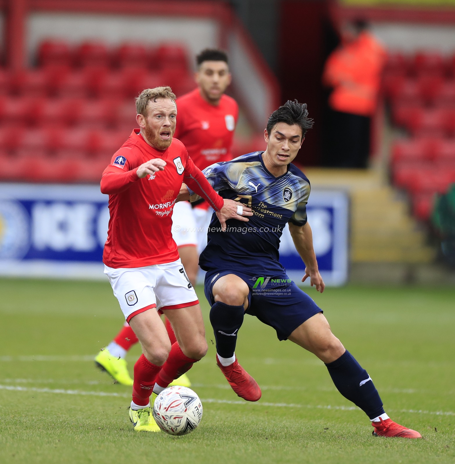 5th January 2020, Alexandra Stadium, Crewe, England; Emirates FA Cup, Crewe Alexandra v Barnsley : Paul Green (12) of Crewe Alexandra and Kenny Dougall (4) of Barnsley challenge for the ball
Credit: Conor Molloy/News Images