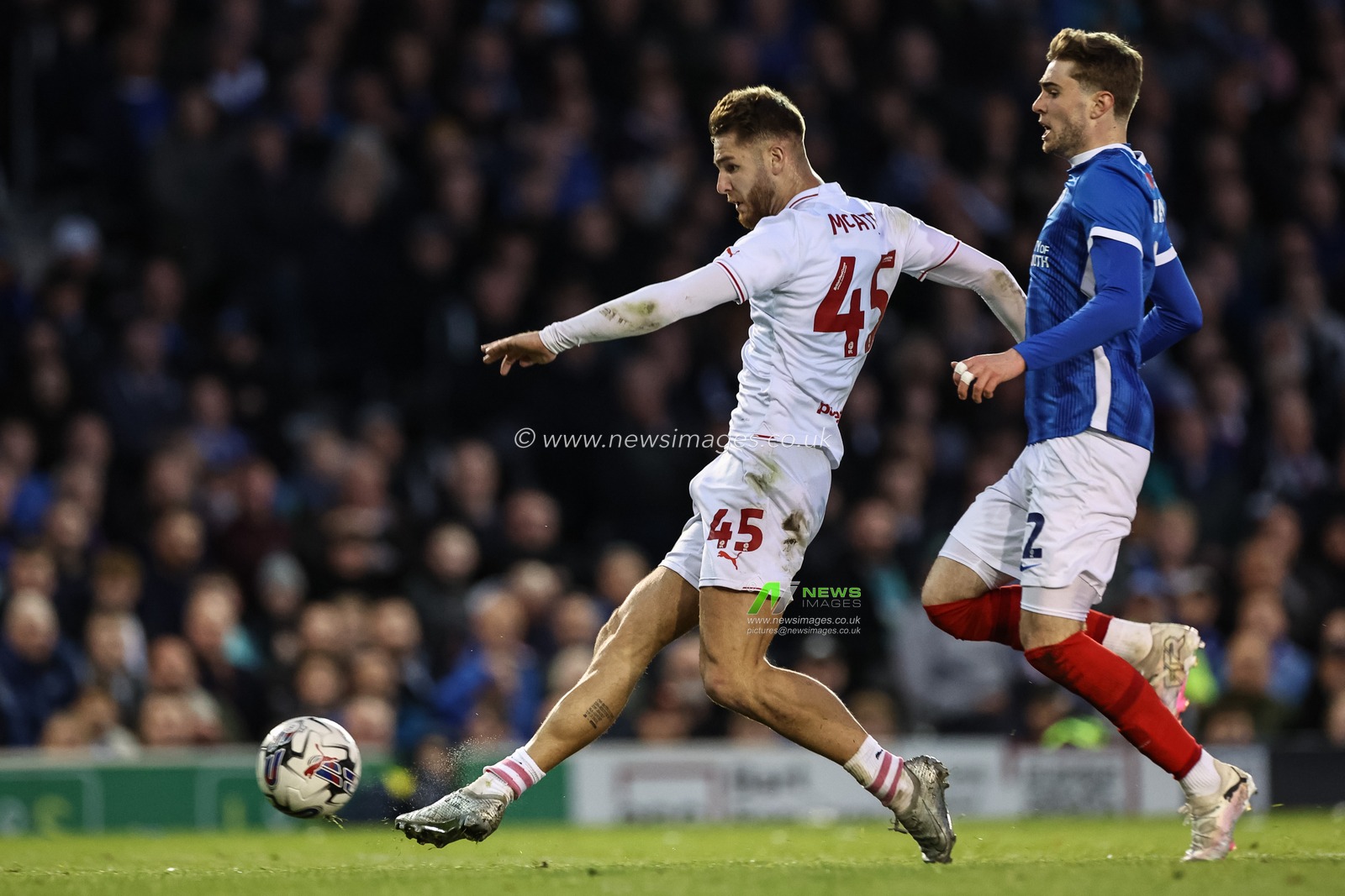 John Mcatee of Barnsley shoots on goal, saved by Will Norris #1 of Portsmouth during the Sky Bet League 1 match Portsmouth vs Barnsley at Fratton Park, Portsmouth, United Kingdom, 16th April 2024

(Photo by Mark Cosgrove/News Images)