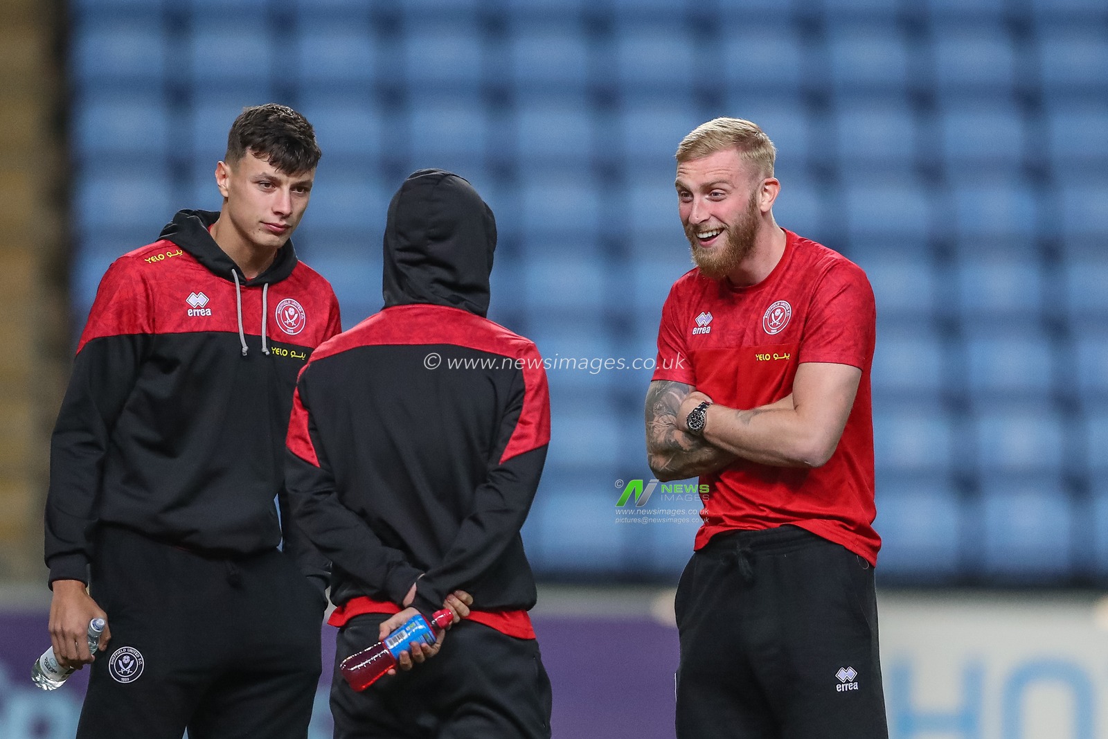 Oliver McBurnie #9 of Sheffield United laughs with teammates before the Sky Bet Championship match Coventry City vs Sheffield United at Coventry Building Society Arena, Coventry, United Kingdom, 19th October 2022

(Photo by Gareth Evans/News Images)