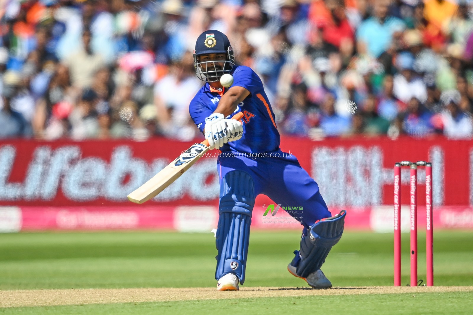 Rishabh Pant of India flicks the ball away