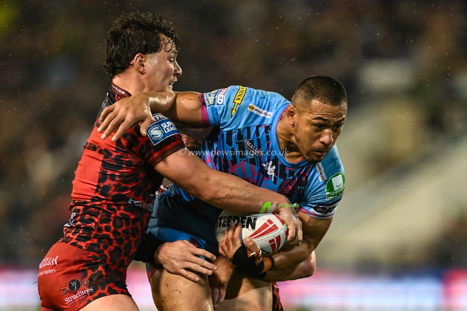 Willie Isa of Wigan Warriors is tackled by Lachlan Lam of Leigh Leopards during the Betfred Super League Round 7 match Leigh Leopards vs Wigan Warriors at Leigh Sports Village, Leigh, United Kingdom, 4th April 2024

(Photo by Craig Thomas/News Images)