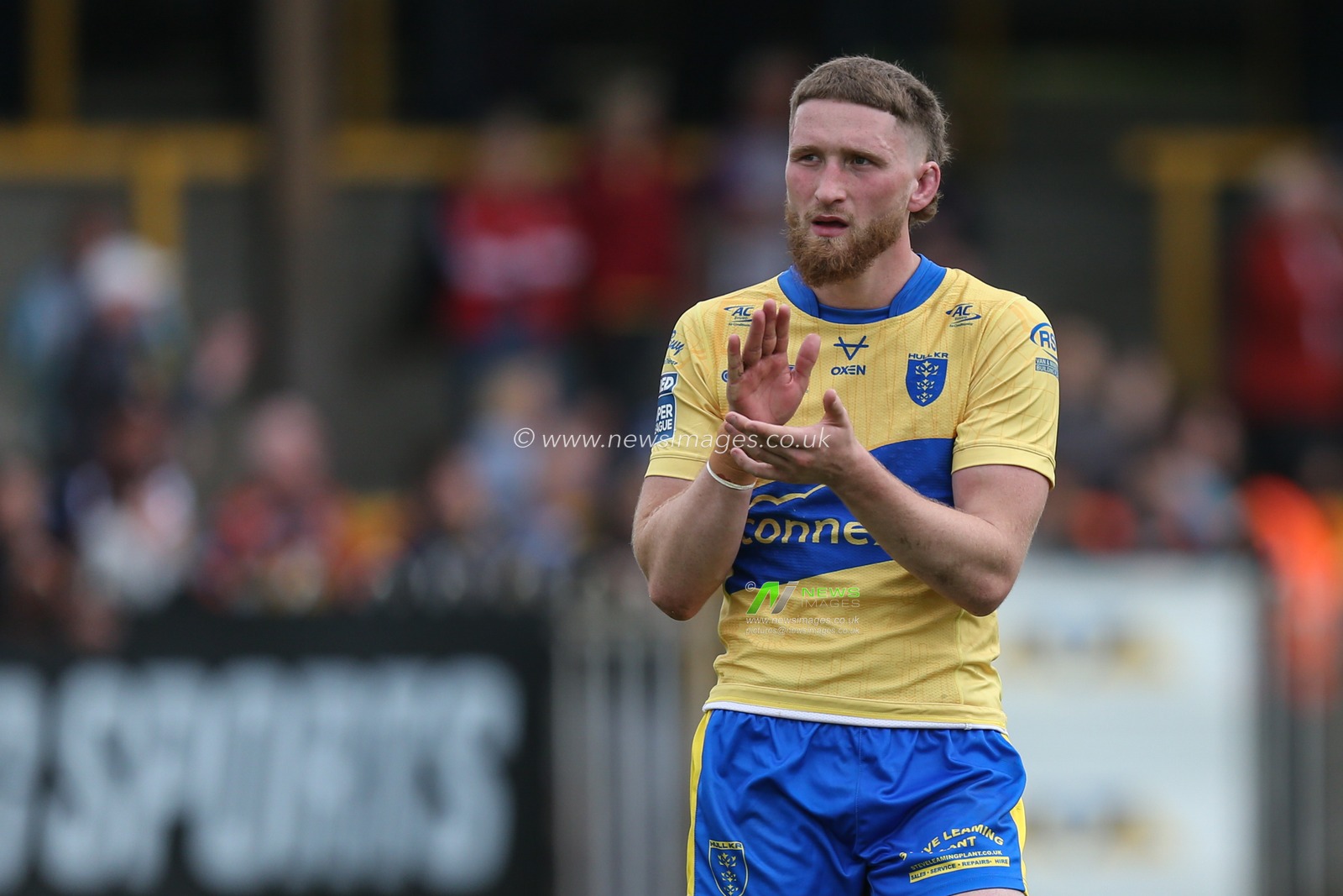 Ethan Ryan #23 of Hull KR applauds the travelling fans