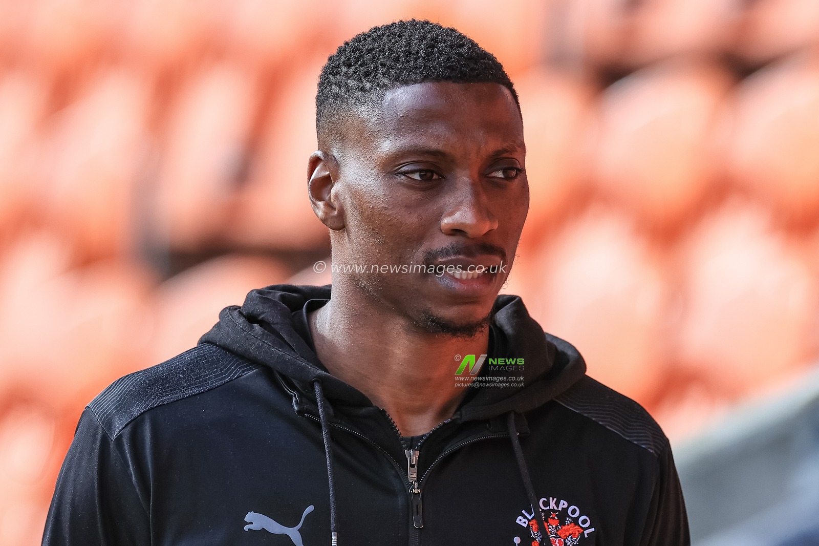 Marvin Ekpiteta #21 of Blackpool arrives at Bloomfield Road