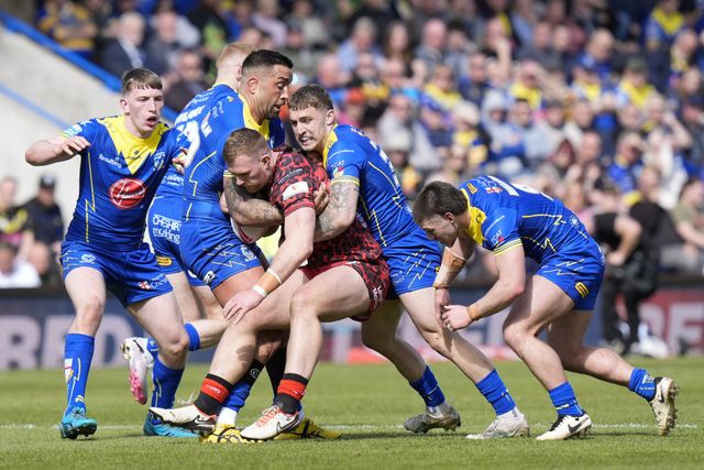 Sam Powell of Warrington Wolves and Paul Vaughan of Warrington Wolves combine to tackle Matty Davis of Leigh Leopards during the Betfred Super League Round 8 match Warrington Wolves vs Leigh Leopards at Halliwell Jones Stadium, Warrington, United Kingdom, 20th April 2024

(Photo by Steve Flynn/News Images)