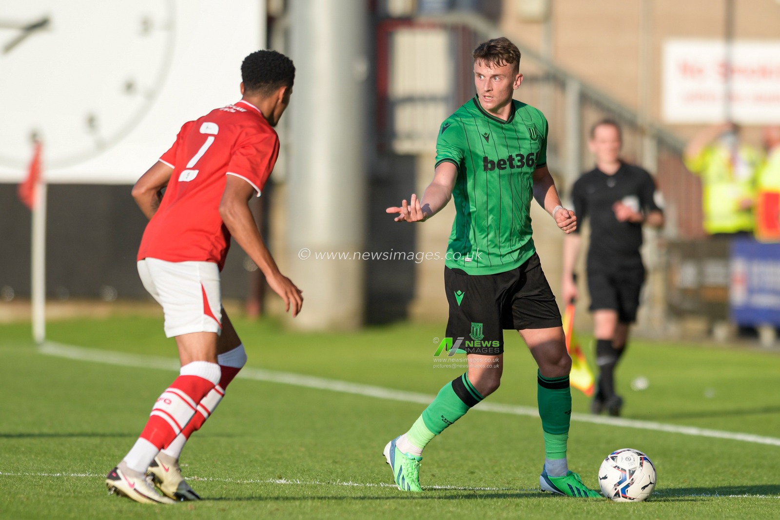 Alfie Doughty #11 of Stoke City looks for a way past Travis Johnson #2 of Crewe Alexandra