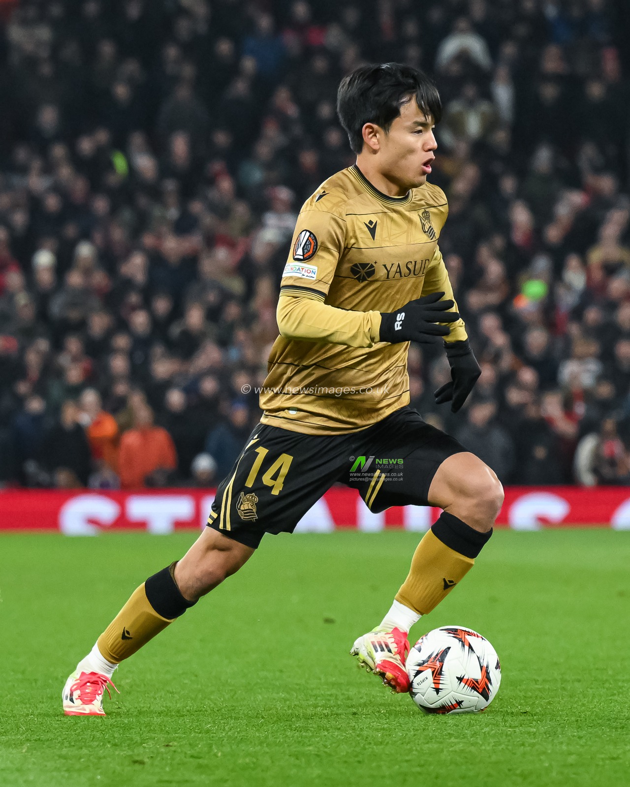 Takefusa Kubo of Real Sociedad makes a break with the ball during the UEFA Europa League Last 16 match Manchester United vs Real Sociedad at Old Trafford, Manchester, United Kingdom, 13th March 2025

(Photo by Craig Thomas/News Images)