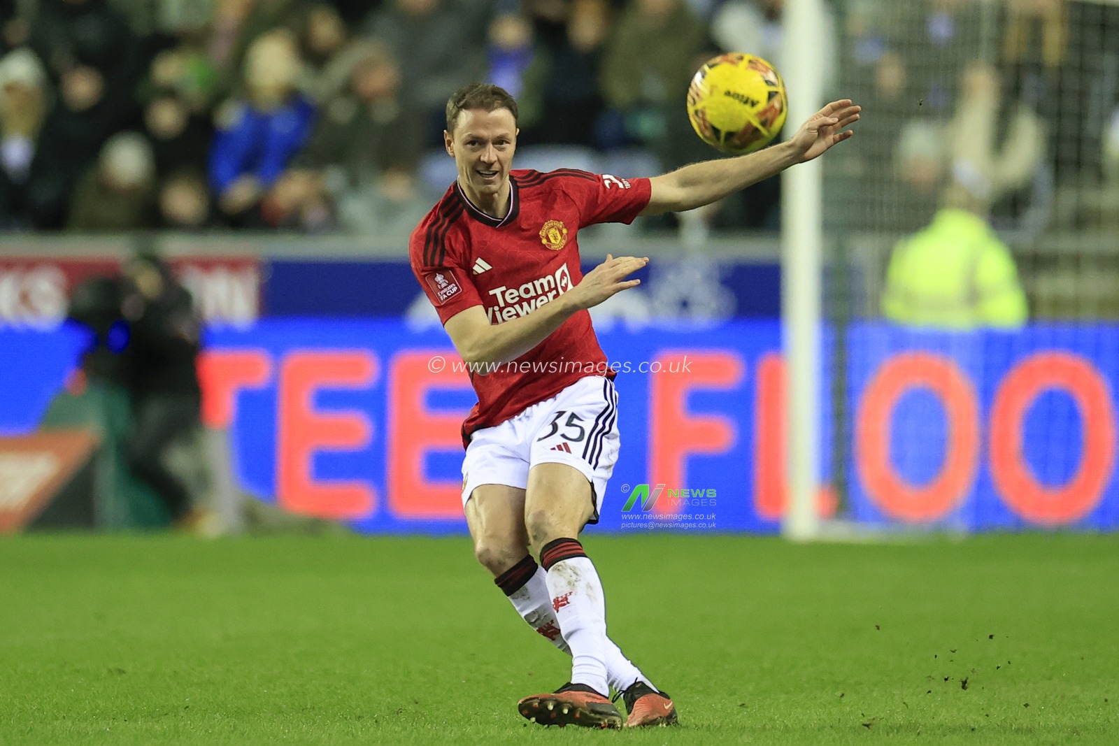Jonny Evans of Manchester United passes the ball during the Emirates FA Cup Third Round match Wigan Athletic vs Manchester United at DW Stadium, Wigan, United Kingdom, 8th January 2024

(Photo by Conor Molloy/News Images)
