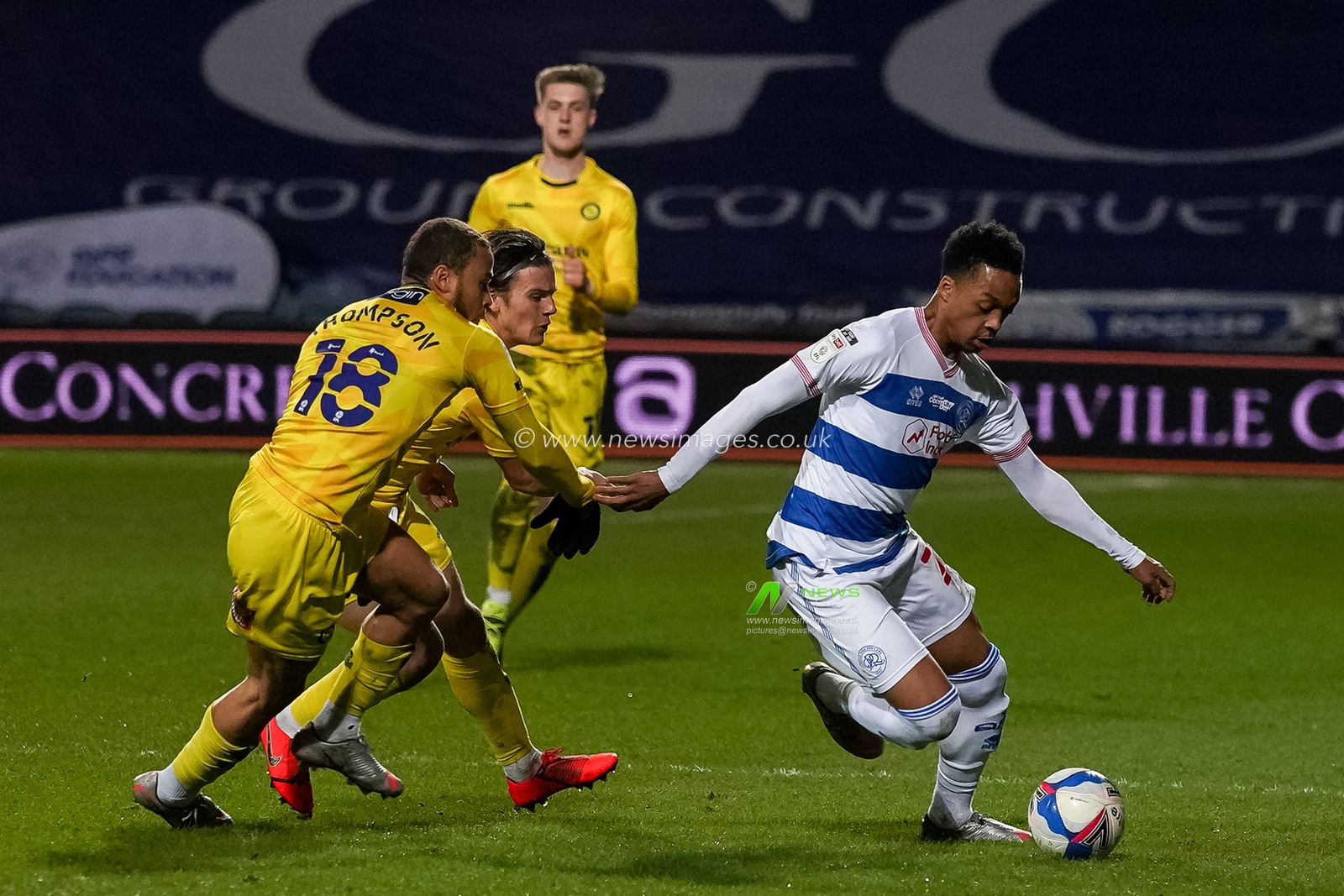 Chris Willock #21 of Queens Park Rangers turns Curtis Thompson #18 of Wycombe Wanderers