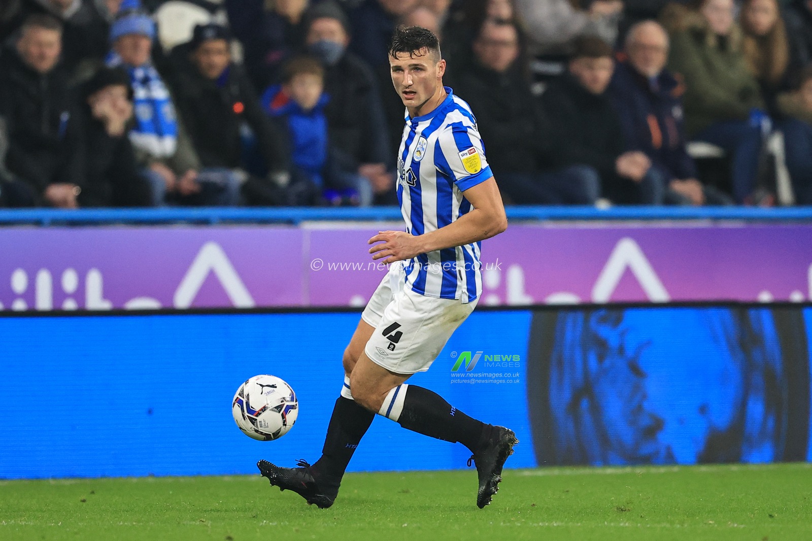 Matty Pearson #4 of Huddersfield Town in action during the game