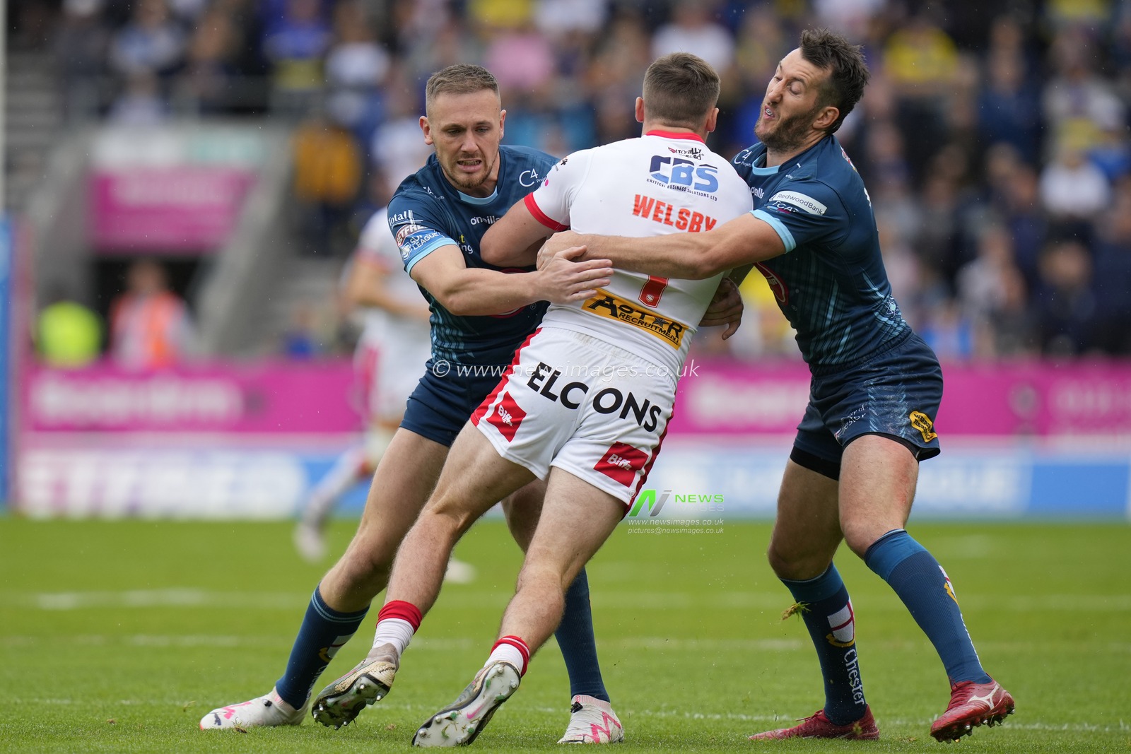 Ben Currie #11 of Warrington Wolves and Stefan Ratchford #4 of Warrington Wolves combiner to tackle Jack Welsby #1 of St. Helens during the Betfred Super League Eliminator match St Helens vs Warrington Wolves at Totally Wicked Stadium, St Helens, United Kingdom, 30th September 2023

(Photo by Steve Flynn/News Images)