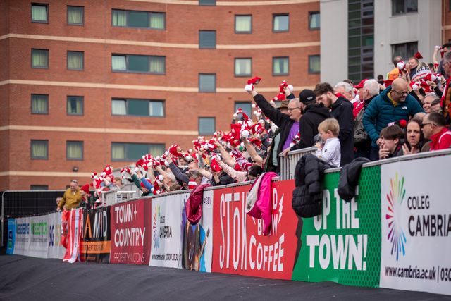 Wrexham fans during the Sky Bet League 1 match Wrexham vs Stockport County at SToK Cae Ras, Wrexham, United Kingdom, 22nd March 2025

(Photo by Nik Mesney/News Images)