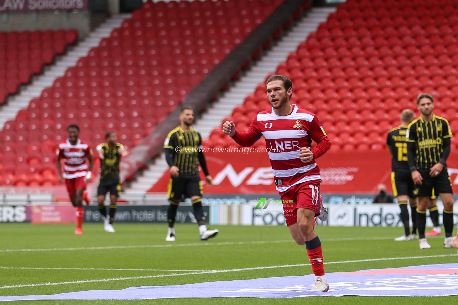 Jon Taylor (11) of Doncaster Rovers celebrates his goal to make it 4-1