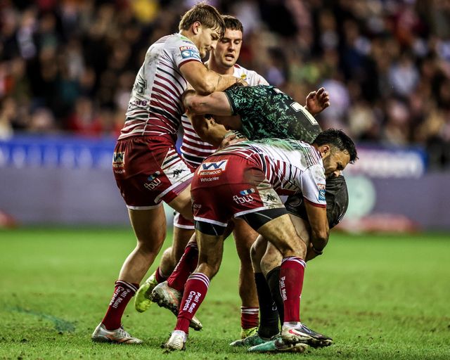 Robbie Mulhern of Leigh Leopards is tackled by Sam Walters of Wigan Warriors and Bevan French of Wigan Warriors during the Betfred Super League match Wigan Warriors vs Leigh Leopards at The Brick Community Stadium, Wigan, United Kingdom on 26 February 2026

(Photo by Alfie Cosgrove/News Images)