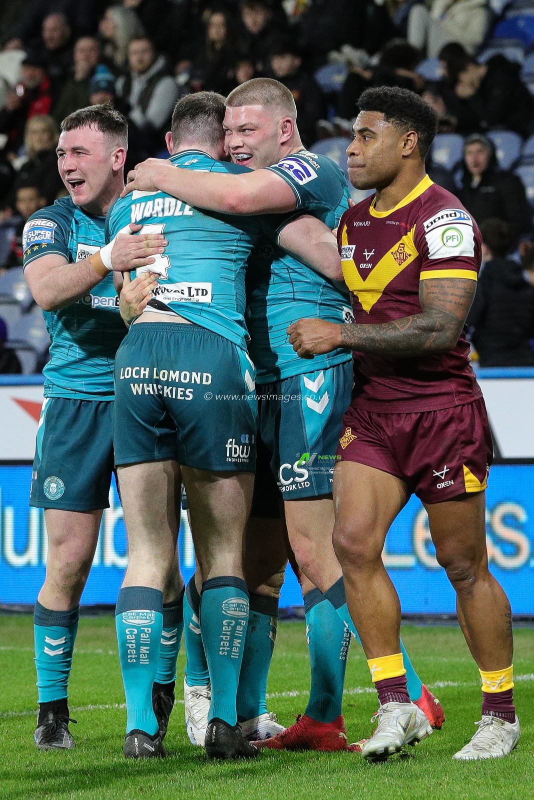 Jake Wardle #4 of Wigan Warriors celebrates his try with his team mates and makes the score 4-8 in the first half of the Betfred Super League Round 5 match Huddersfield Giants vs Wigan Warriors at John Smith's Stadium, Huddersfield, United Kingdom, 17th March 2023

(Photo by James Heaton/News Images)