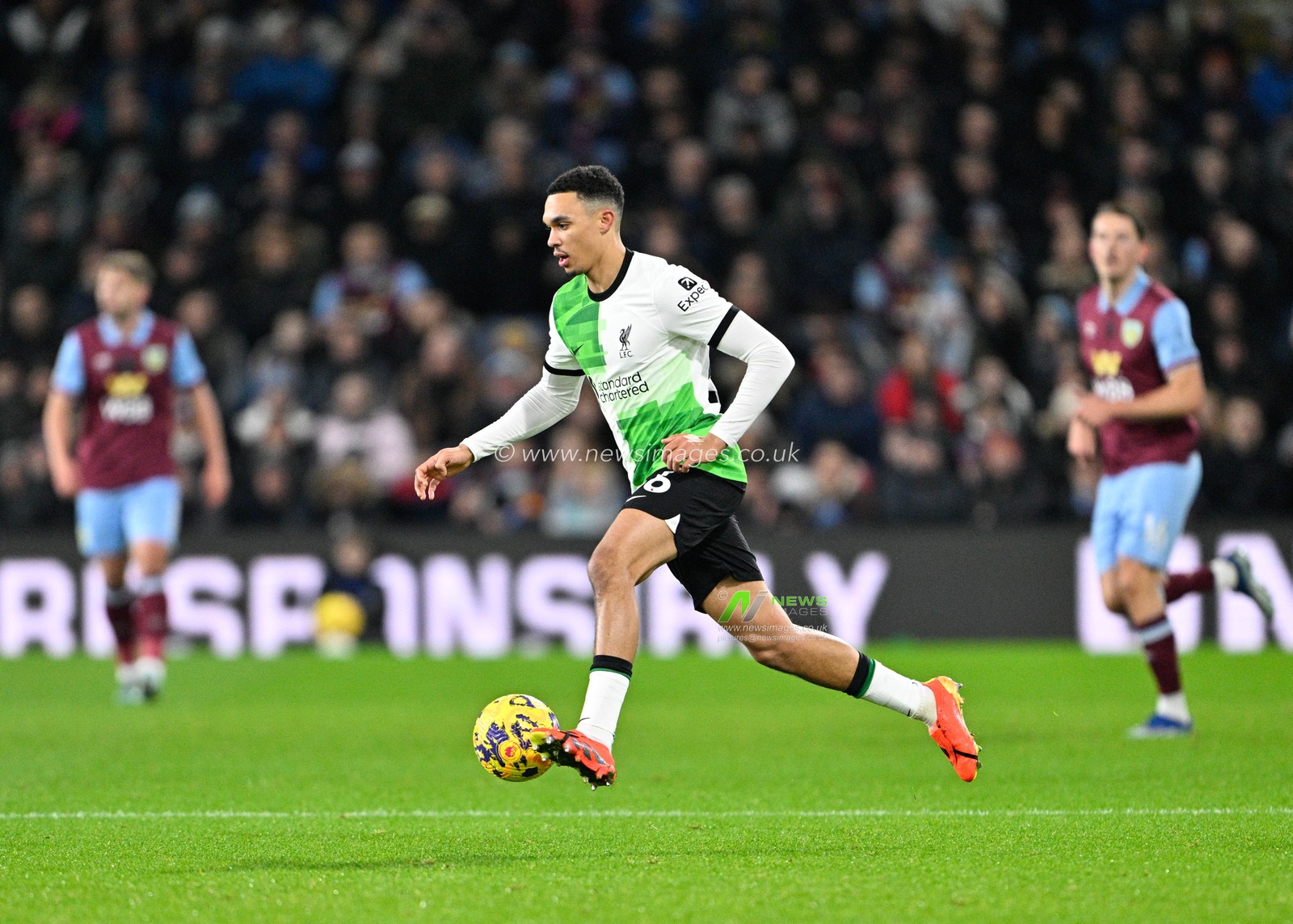 Trent Alexander-Arnold 66# of Liverpool Football Club drives with the ball, during the Premier League match Burnley vs Liverpool at Turf Moor, Burnley, United Kingdom, 26th December 2023

(Photo by Cody Froggatt/News Images)