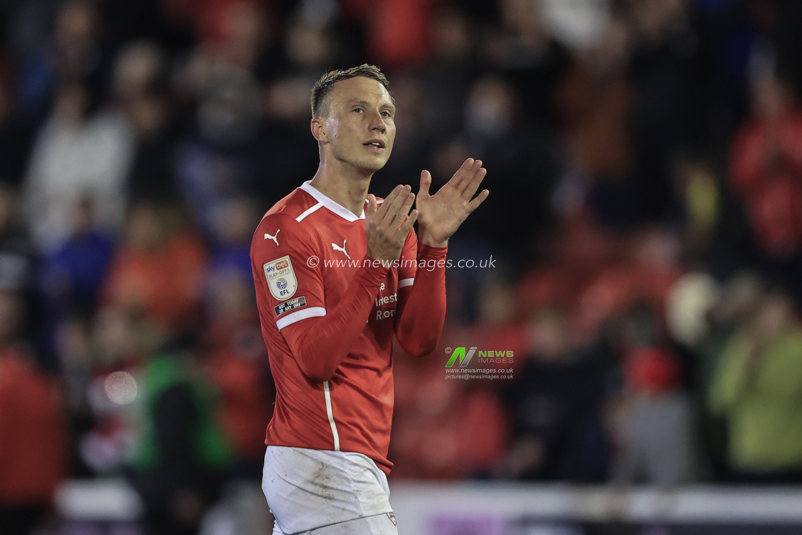 Cauley Woodrow #9 of Barnsley applauds the Ponty End after the final whistle