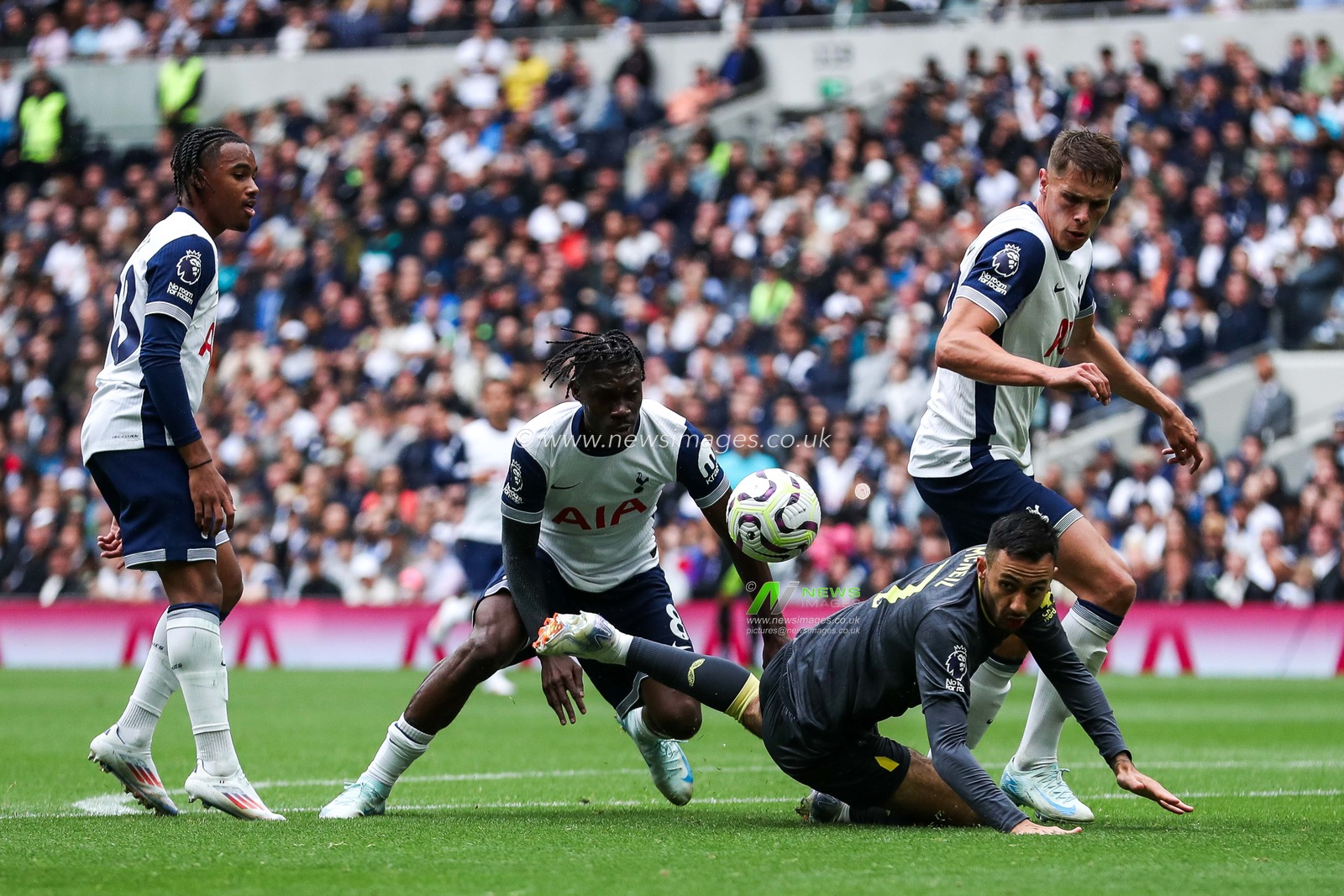 Dwight McNeil of Everton is tripped during the Premier League match Tottenham Hotspur vs Everton at Tottenham Hotspur Stadium, London, United Kingdom, 24th August 2024

(Photo by Izzy Poles/News Images)