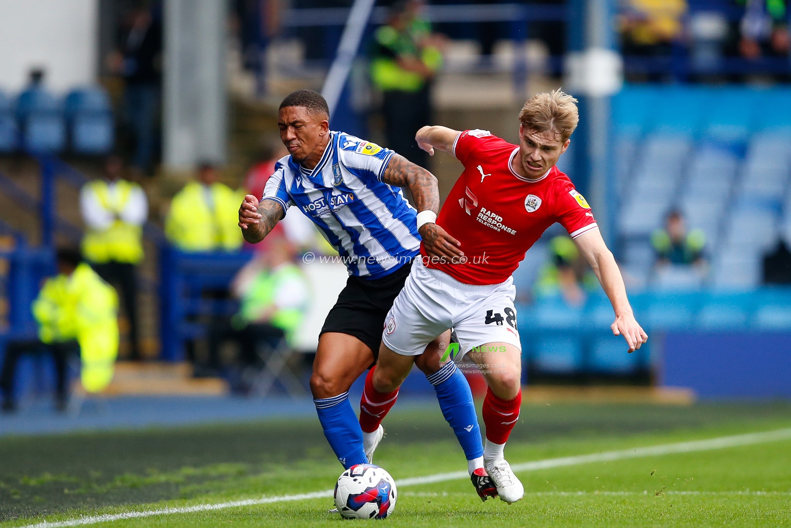 Luca Connell #48 of Barnsley and Liam Palmer #2 of Sheffield Wednesday during the Sky Bet League 1 match Sheffield Wednesday vs Barnsley at Hillsborough, Sheffield, United Kingdom, 3rd September 2022.

(Photo by Ben Early/News Images)