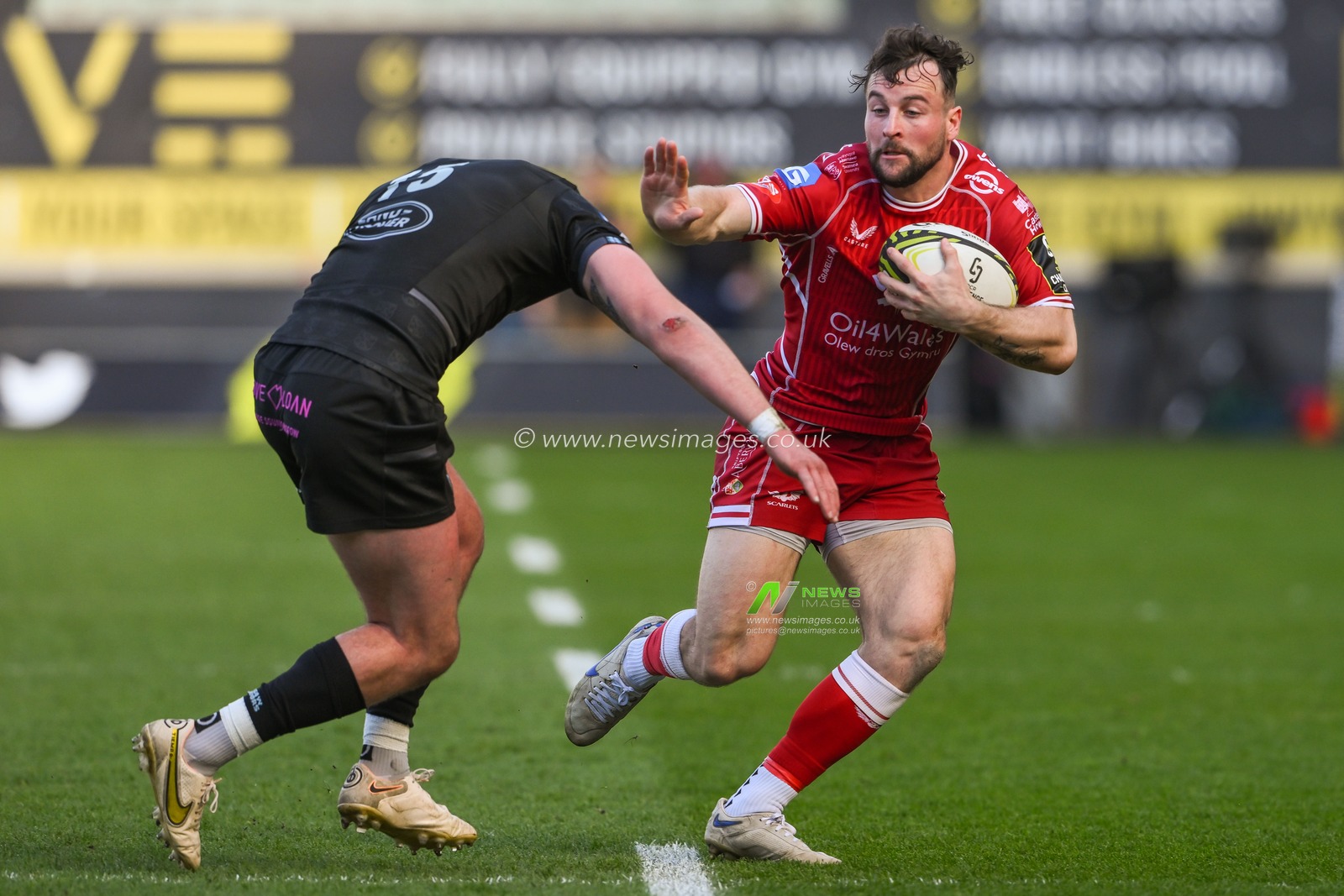 Ryan Conbeer of Scarlets fends off Ollie Smith of Glasgow Warriors during the European Challenge Cup Semi-Final match Llanelli Scarlets vs Glasgow Warriors at Parc y Scarlets, Llanelli, United Kingdom, 29th April 2023

(Photo by Craig Thomas/News Images)