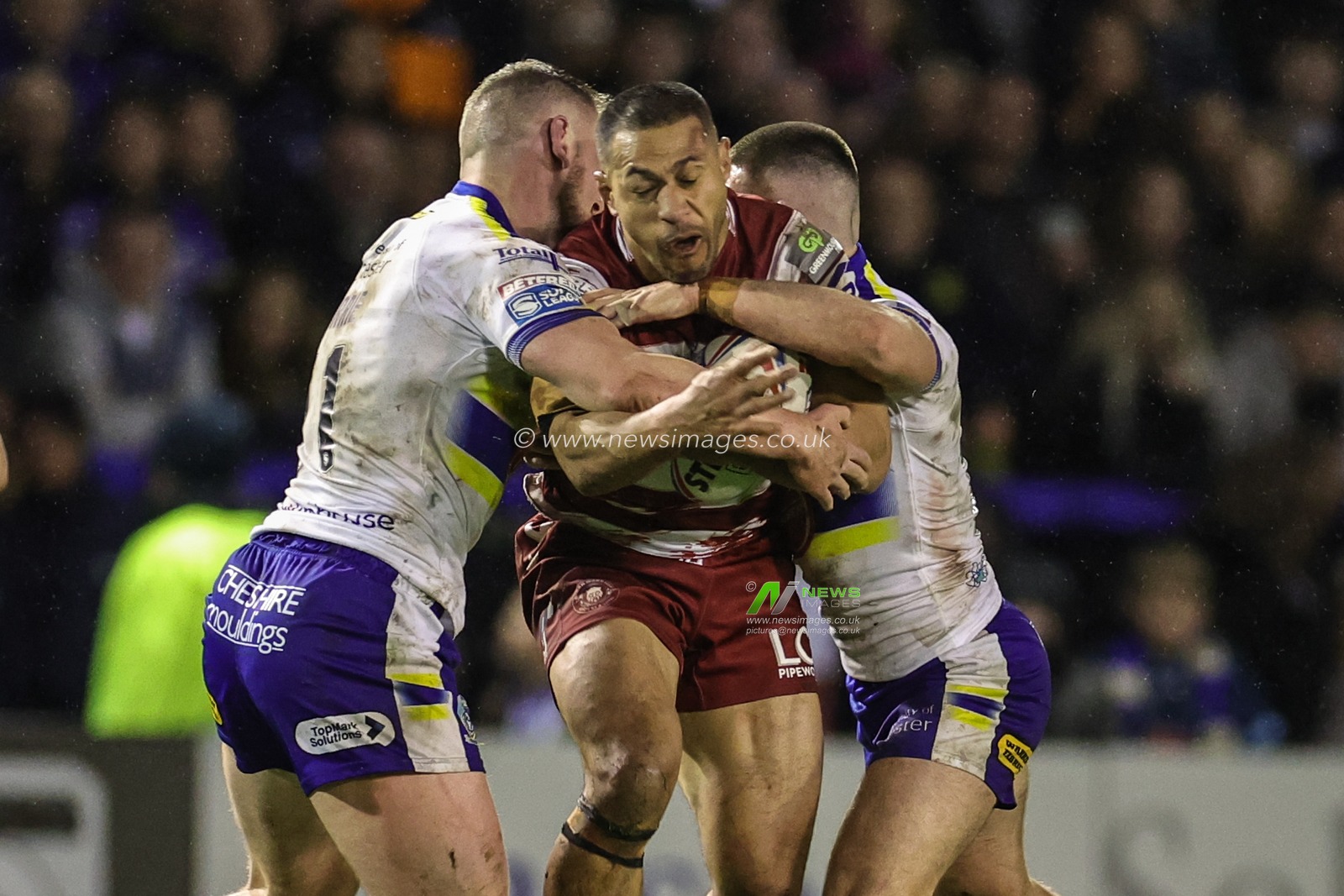 Willie Isa #11 of Wigan Warriors is tackled by Ben Currie #11 of Warrington Wolves during the Betfred Super League Round 9 match Warrington Wolves vs Wigan Warriors at Halliwell Jones Stadium, Warrington, United Kingdom, 14th April 2023

(Photo by Mark Cosgrove/News Images)
