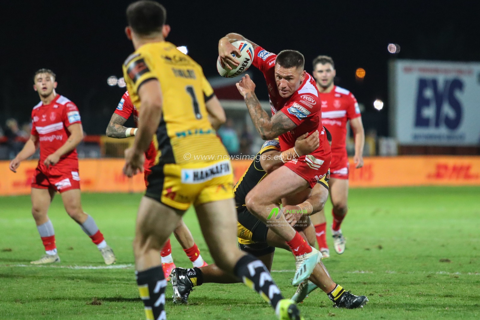 Shaun Kenny-Dowall (4) of Hull KR makes a charge for the try line