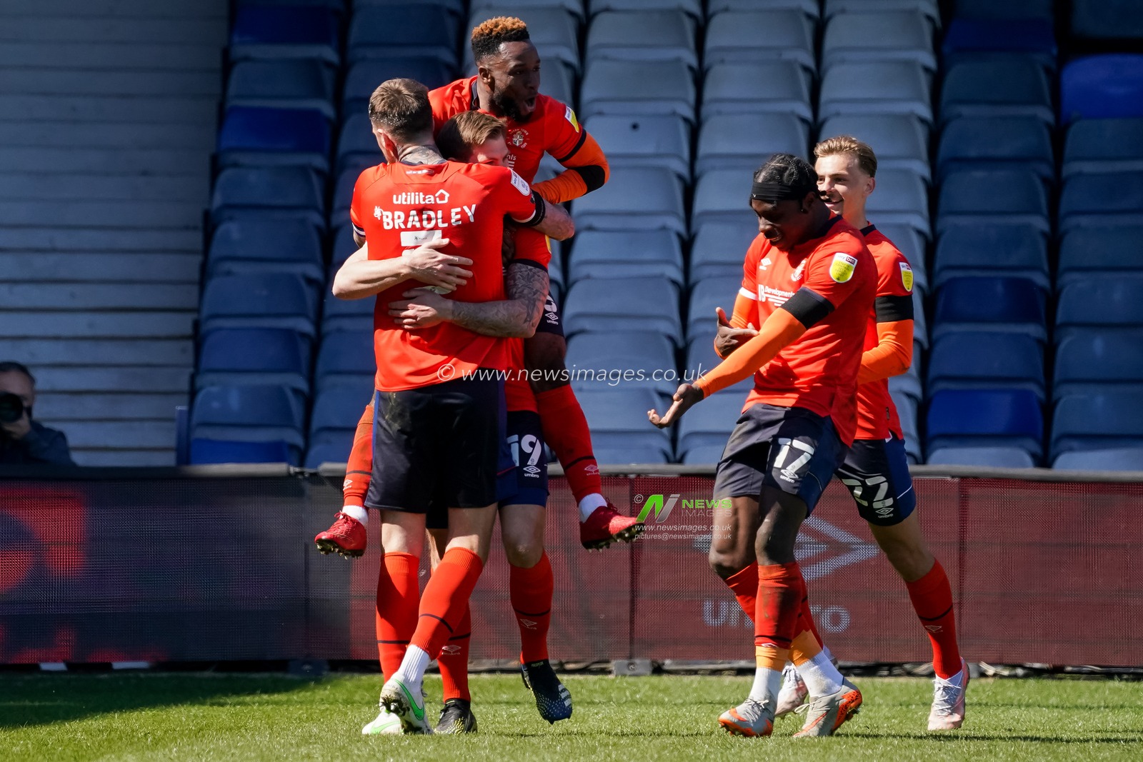 James Collins #19 of Luton Town celebrates scoring from the penalty spot with his team mates